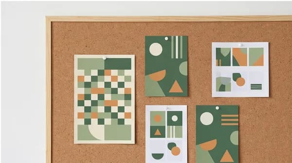 A planning board with coordinated fictional print and digital campaign artwork, no metrics or performance claims.