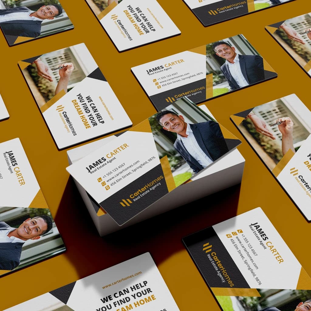 Real estate business cards with photographs, a white and black layout, and gold accents.