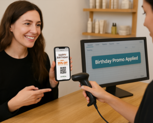 Customer redeeming a birthday promo on her phone at checkout by scanning a QR code.