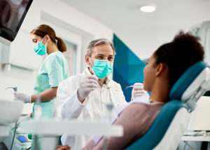 Dentist consulting with a patient in a dental office, building trust and patient confidence.