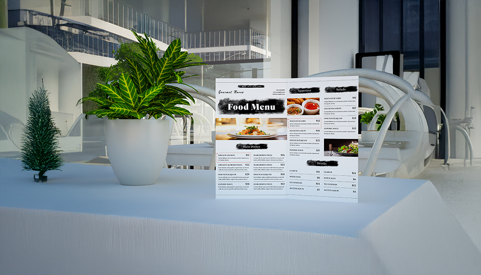Restaurant menu beside a plant