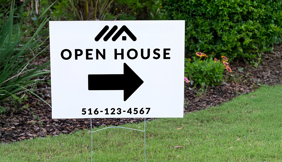Open-house yard sign with directional arrow