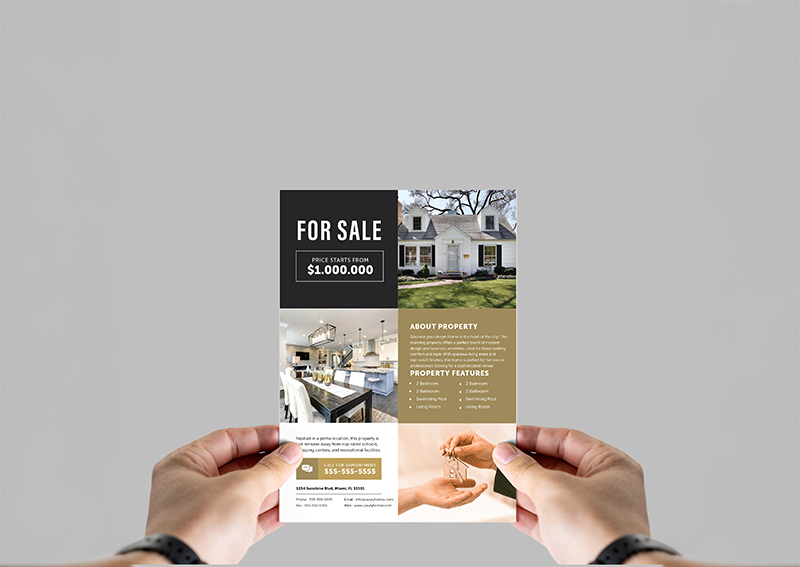 Hands holding a real-estate flyer