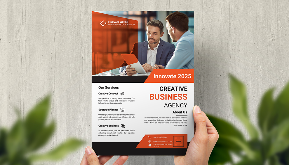 Hand holding a business-services flyer