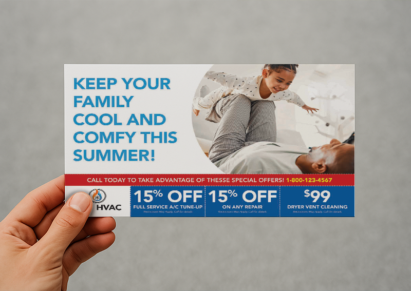 Hand holding an HVAC promotional postcard